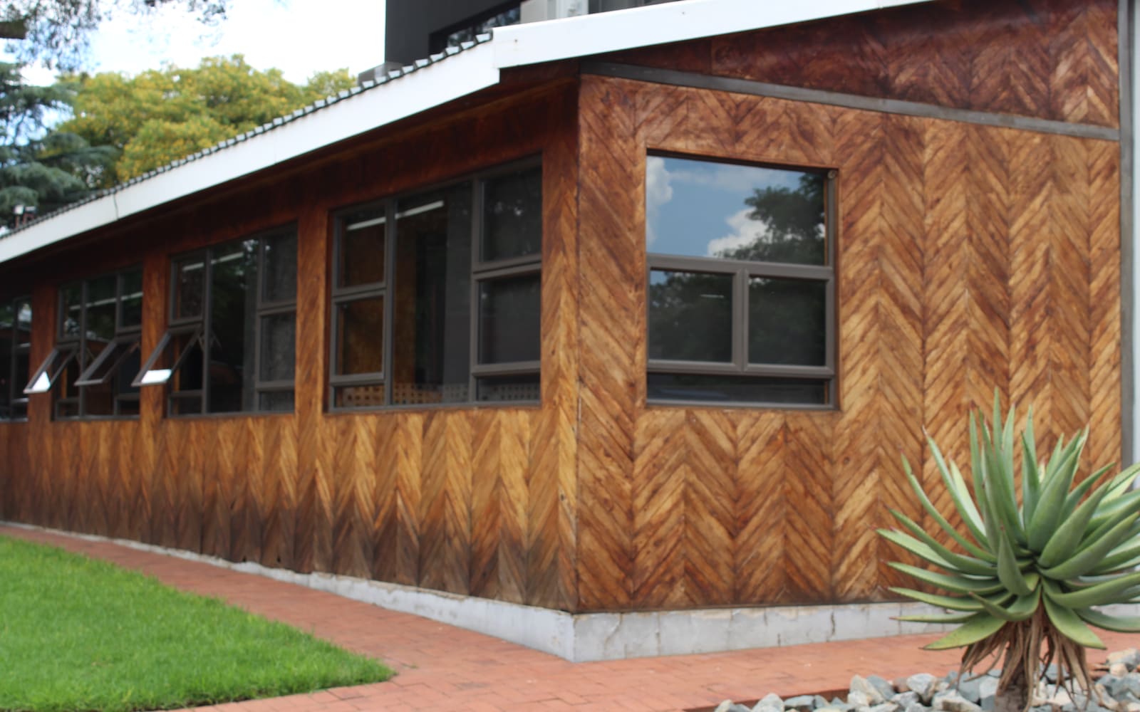 Workplace clad in reclaimed timber