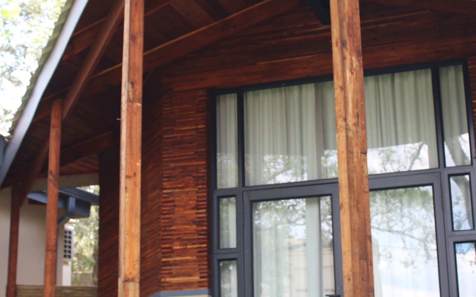Reclaimed timber hospitality unit among trees